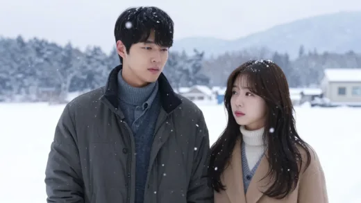 A scene from the Korean drama "Winter Sonata" with lead actors Bae Yong-joon and Choi Ji-woo, set in a beautiful snowy landscape, evoking a sense of romance and nostalgia. The image should capture the dramatic and emotional essence of the early Hallyu wave in Japan.