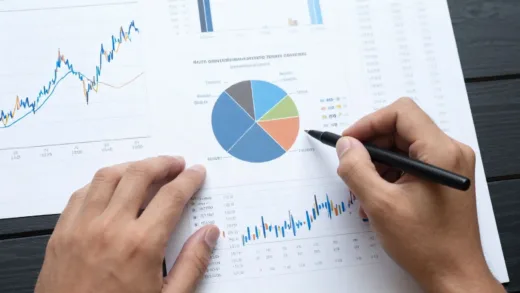 A person diligently managing their finances amidst a turbulent economic backdrop, with charts and graphs showing fluctuating markets in the background.