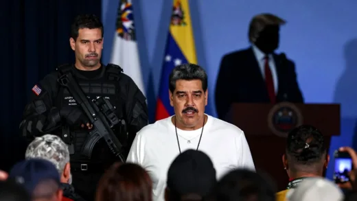 A dramatic depiction of Venezuelan President Nicolas Maduro being apprehended by US special forces, with a silhouette of Donald Trump in the background making a declaration. A crowd of people in the foreground shows mixed reactions of hope and concern.