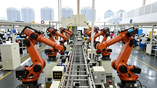 A futuristic factory floor in China with advanced robots working alongside traditional assembly lines, symbolizing the dual strategy of automation and high-tech advancement in manufacturing, with a bustling cityscape in the background.