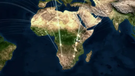An abstract representation of global attention converging on a specific spot in the Horn of Africa, stylized map with glowing lines of interest.