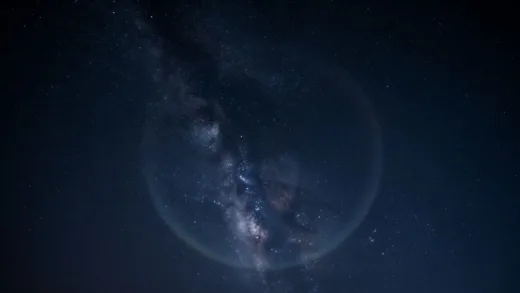 A captivating image showing a starry night sky with a subtle gravitational lensing effect, representing the mysterious nature of gravity and the universe.