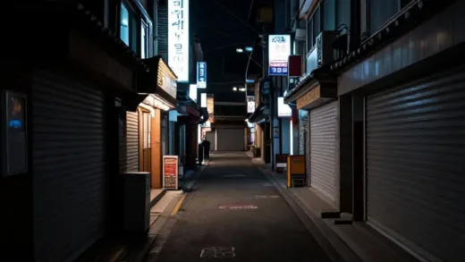 A quiet, empty alley at night with closed traditional Korean pubs and bars, neon signs turned off, showing urban decay and economic change, cinematic lighting, melancholic mood
