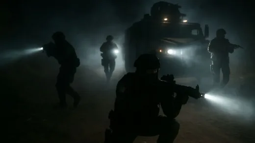 Mexican special forces conducting a night raid operation in a rural area, tactical military vehicles, intense atmosphere with flashlights and gear