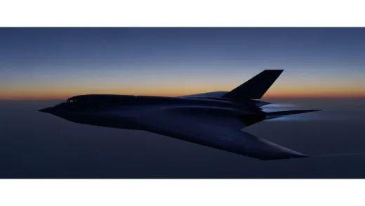 A futuristic, dark, and sleek B2 Spirit stealth bomber flying silently against a twilight sky, viewed from slightly below, emphasizing its unique, tailless, bat-like silhouette. The surface is matte, absorbing all light.