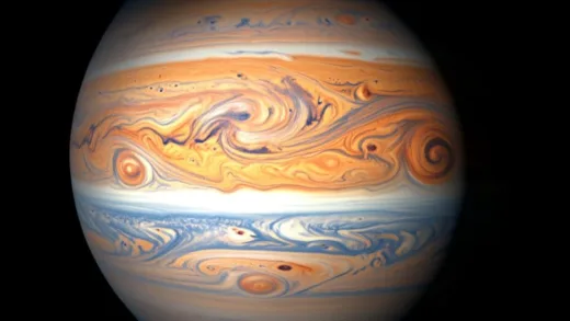A stunning high-resolution photograph of Jupiter taken by Juno spacecraft, showing swirling ammonia clouds in orange, white, and blue bands, with detailed storm patterns, 3D appearance with shadows cast by high-altitude clouds