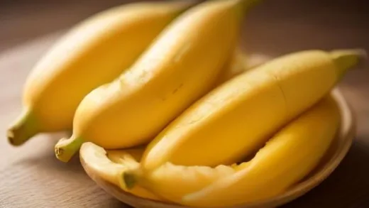 Fresh yellow bananas on a rustic wooden table with soft morning sunlight, sliced banana pieces revealing creamy white flesh, glowing superfood aesthetic, high-resolution food photography, shallow depth of field